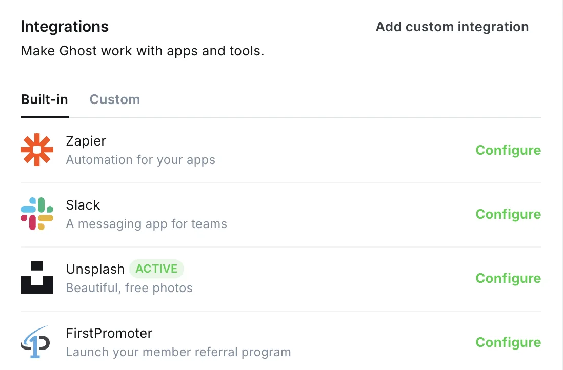 Ghost admin Integrations settings on a Luxe Themes demo site, Built-in tab, listing Zapier with a Configure link above Slack, Unsplash and FirstPromoter